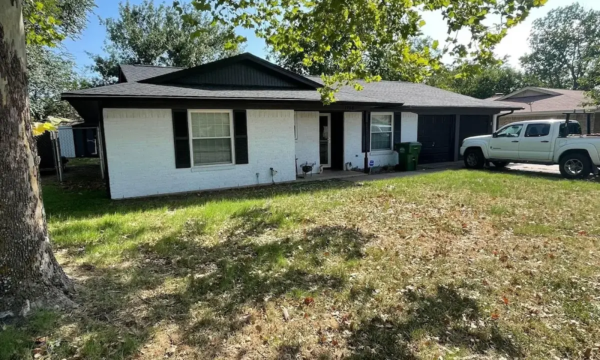Professional roofing crew working on a residential roof in Nether Providence